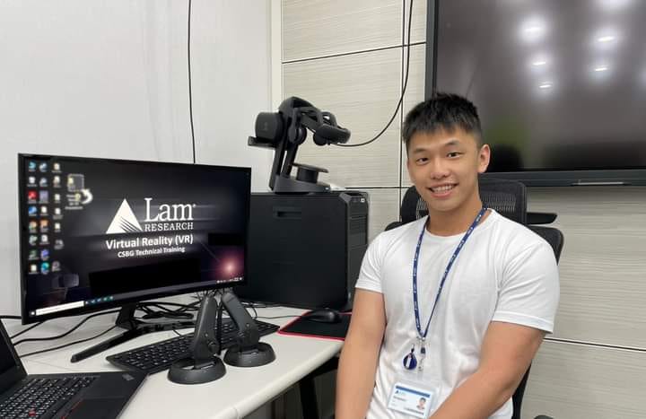 young Asian man, smiling, Lam Research, computer lab workspace, employee