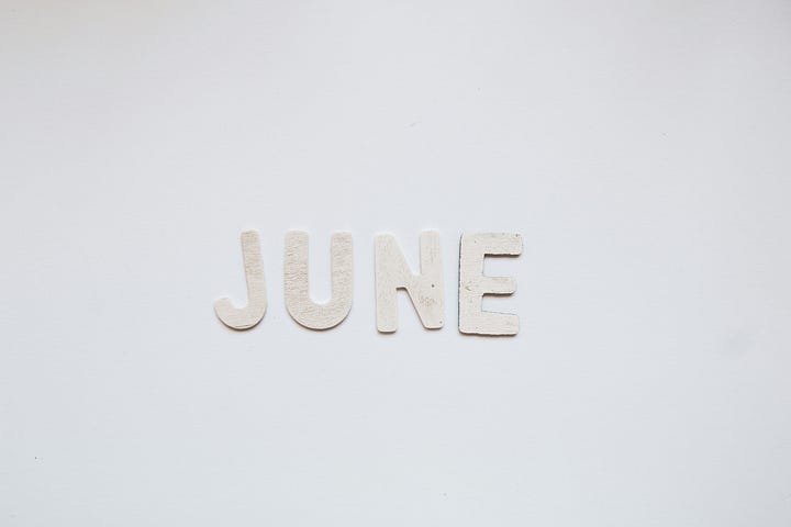 White font word of June