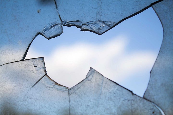 Broken window with hole