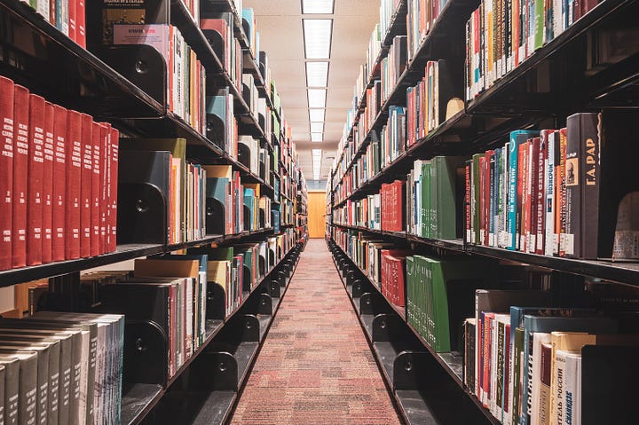 Shelves of colorful books as far as the eye can see.