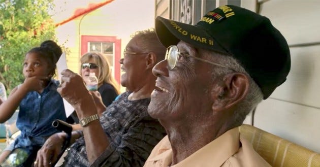 Richard Overton sitting on his front porch.