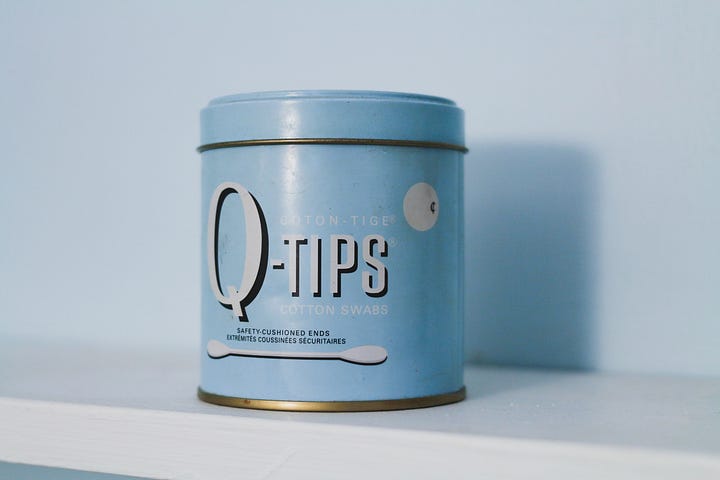 An antique can of Q-tips.