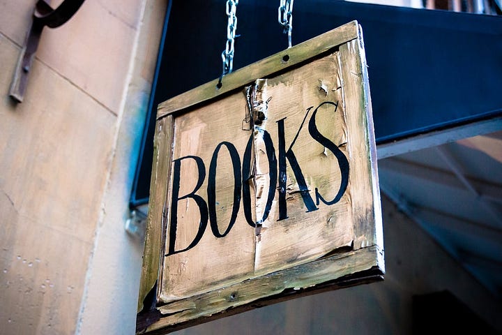 This quaint sign hangs outside Desperate Literature, an international bookstore in downtown Madrid.