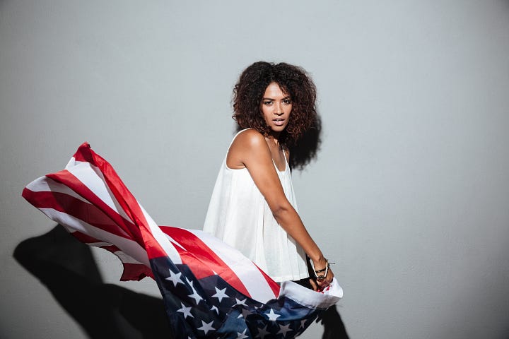 Sexy Black woman twirling the American flag