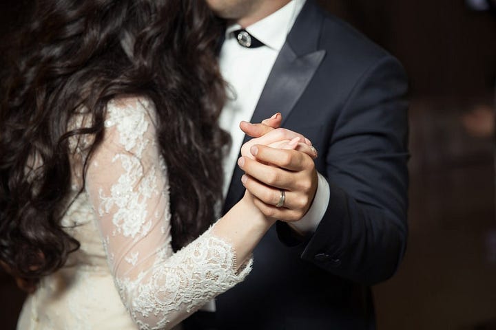 bride and groom dancing