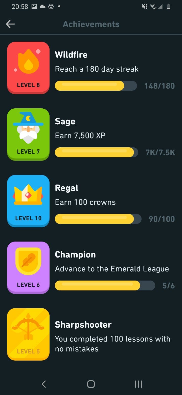 Screenshot of various badges a user can win when completing certain challenges in Duolingo: Sage, Regal, Champion