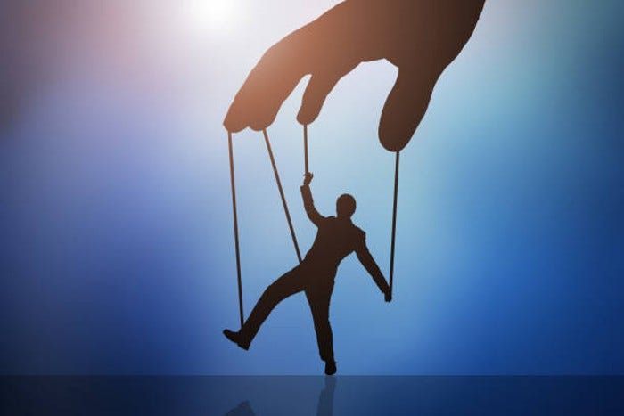 Silhouette of a hand moving a man held with strings, like a puppet.