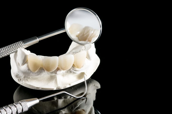 Closeup / prosthodontics or prosthetic / tooth crown and bridge implant dentistry equipment and model express fix restoration