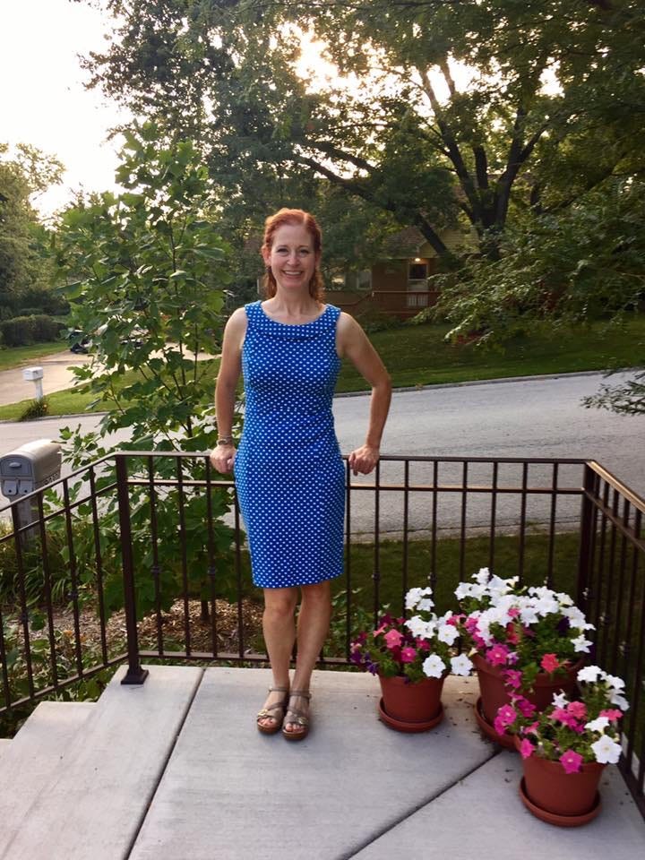 Photo of author standing outside of her house.