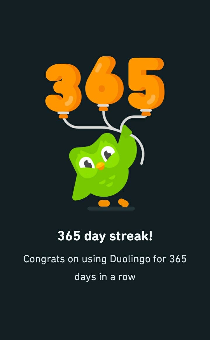 Screenshot of Duolingo’s mascot, Duo the bird, congratulating me for 365 days of using the app