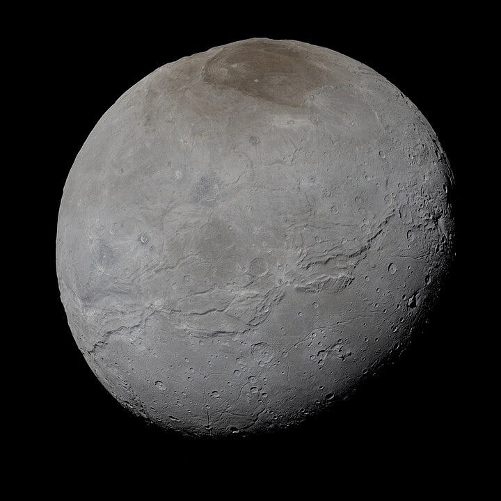 Charon as imaged by the New Horizons spacecraft, July 2015. A massive fault system involving Serenity Chasma and Mandjet Chasma crosses Charon’s equator, while Charon’s north pole is covered by the dark Mordor Macula