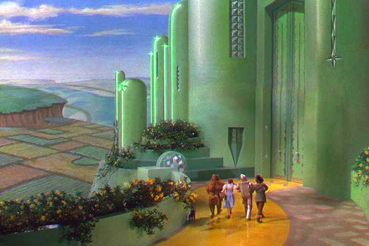 Screenshot from the Wizard of Oz showing the main characters entering the Emerald City.