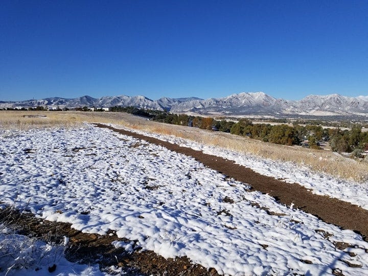 An unseasonably early dusting of snow on the Colorado mountains