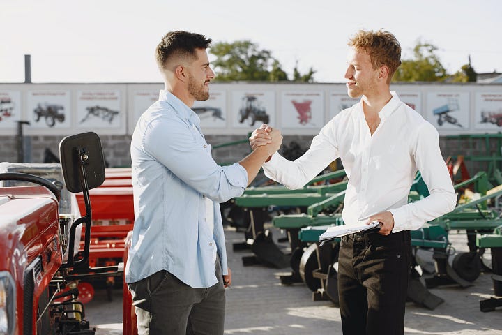 Two white guys doing a bro handshake