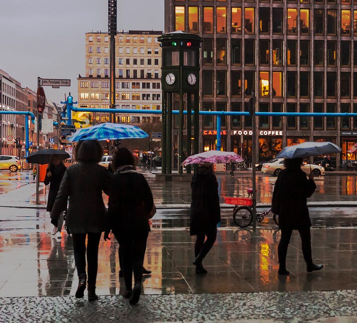 Group of people in the rain on Potsdamer Platz Berlin 2019