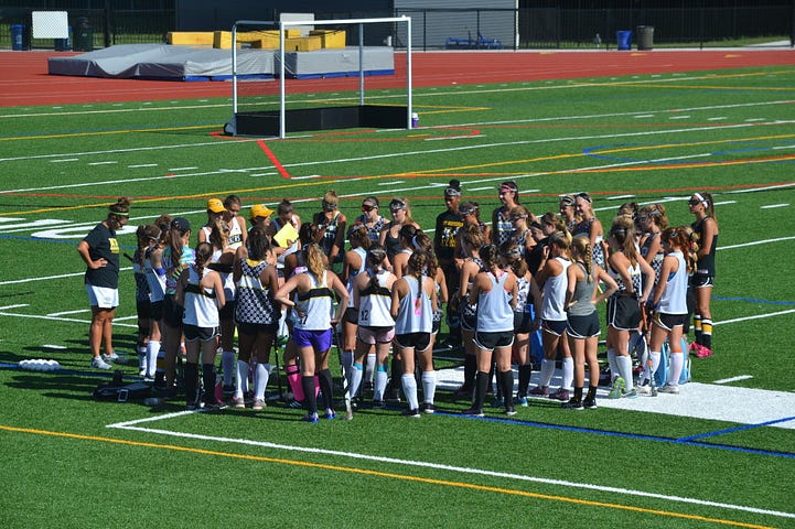 The Moorestown High School Field Hockey team gathered together in a huddle at their first pre-season practice on Monday, August 22. 