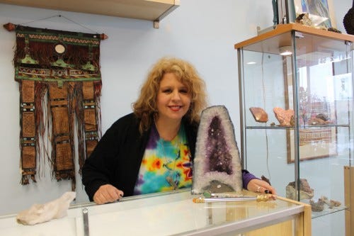 JACK FIRNENO / WIRE PHOTOS Rina Elyce stands in her crystal healing shop on York Road in Hatboro. The store has fossils and crystals for sale that are believed to have healing power. Elyce also offers meditation workshops and various other classes. 