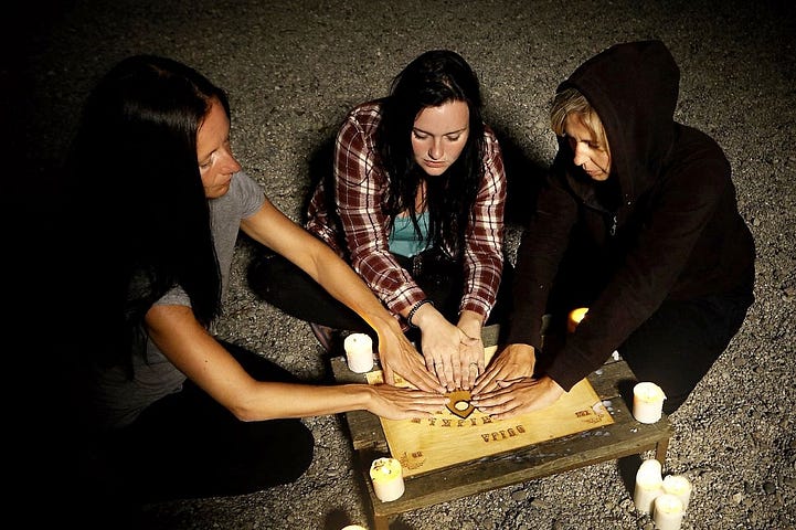 Three girls and an Ouija board