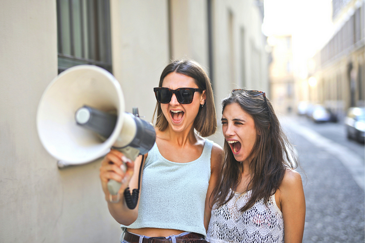 Two young girls with loudspeakers indicating the use of CTAs