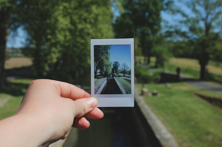 Person holding a photograph