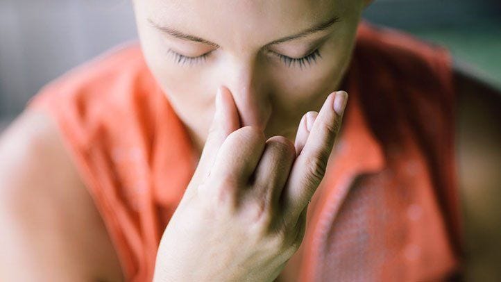 A girl is practicing breathing exercise