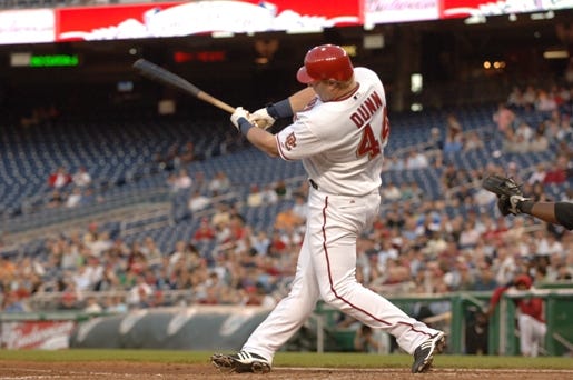 Washington Nationals baseball player Adam Dunn poses with his wife