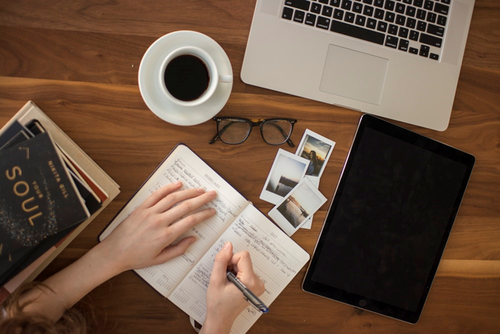 Marketing your book whilst sitting in front of a laptop with coffee and a notebook in hand