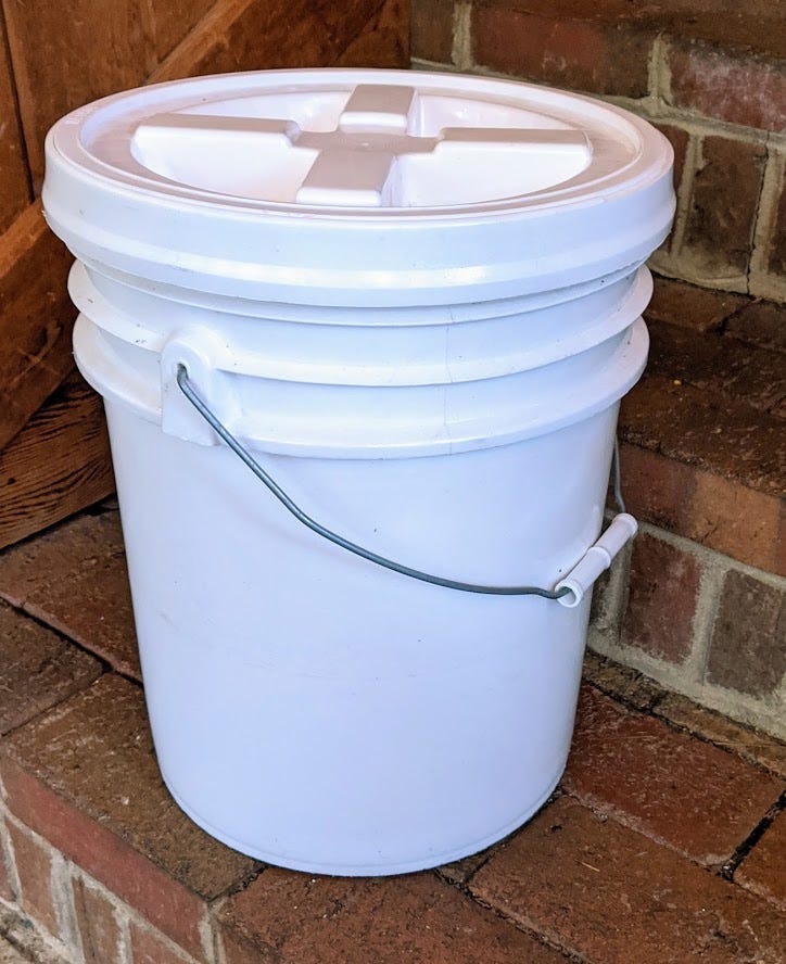 A plastic 5-gallon bucket with a gamma-seal lid