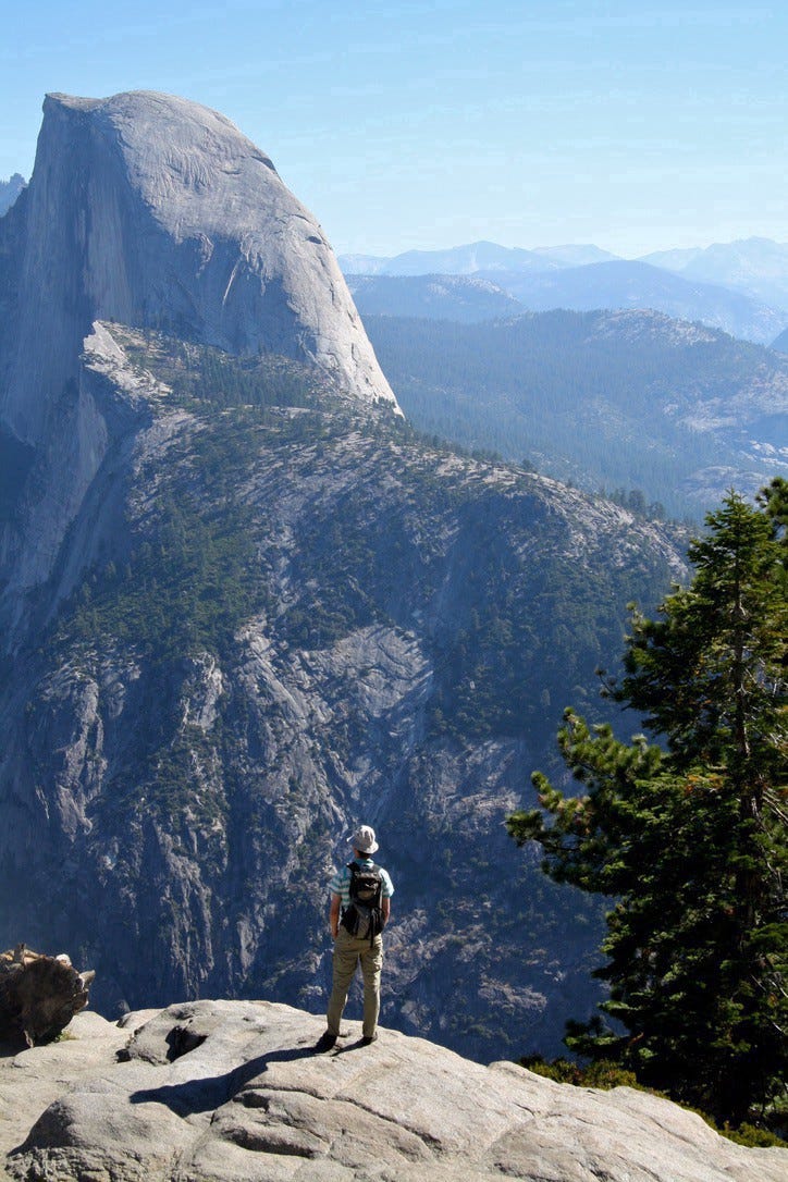 A picture of me looking out over Half Dome in Yosemite National Park.