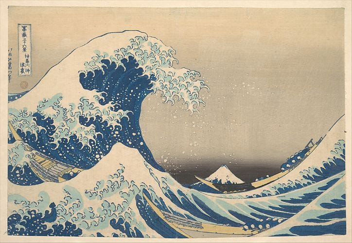 A great wave towering over two fishing boats in the Japanese woodblock style by Hokusai.