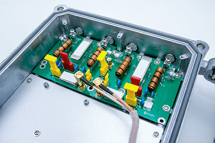 A metal enclosure inside which a printed circuit board is fixed.