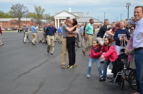 Candidate families greeting their successful candidates on Family Day, OCC 209