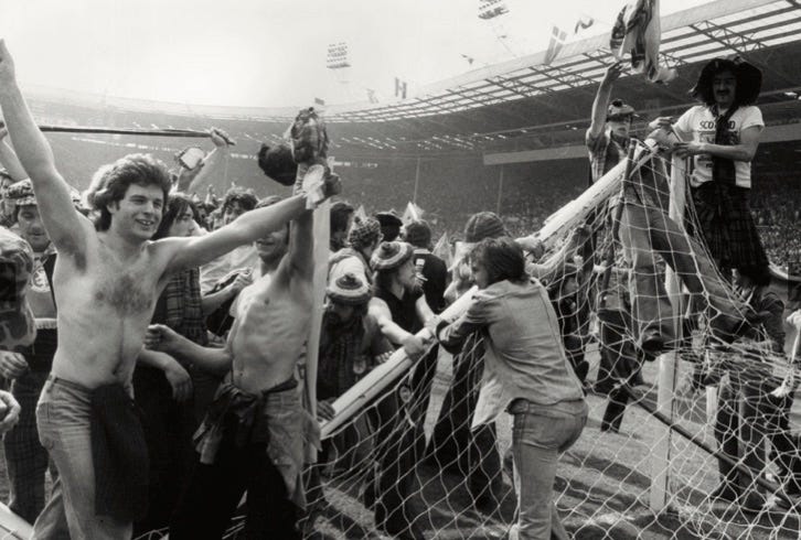 Photo of Scotland fans who have invaded the Wembley pitch after a victory over England in 1977