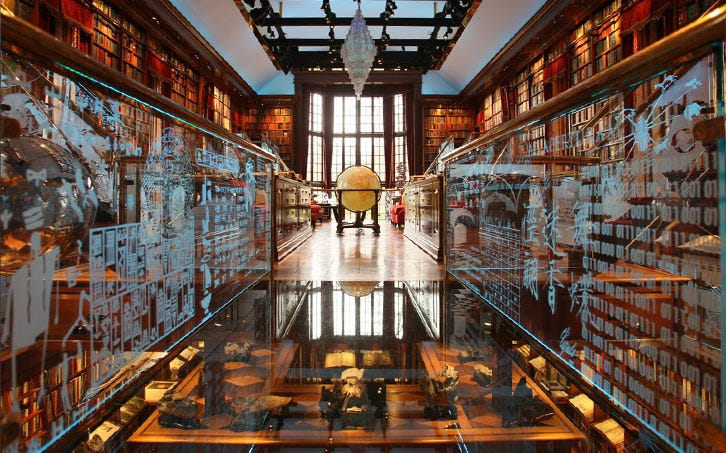 An obscenely beautiful library with etched glass partitions, glass floor and well-lit books. Akin to something from Hogwarts