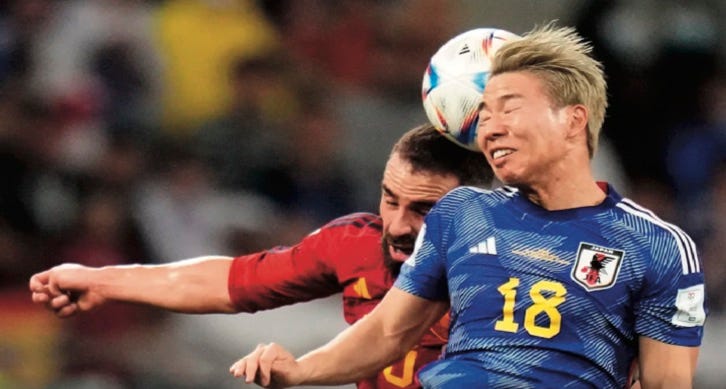 photo of Japanese player winning the ball during a header