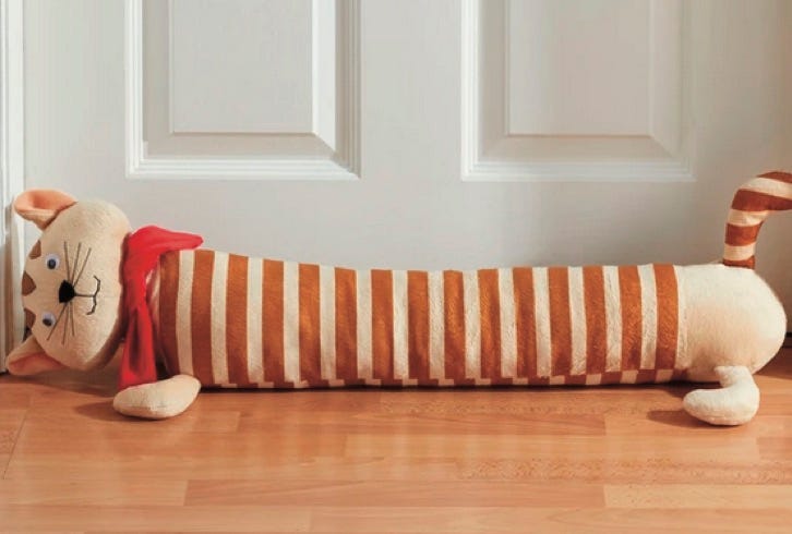 photo of draft excluder against a door