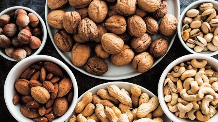 photo of various bowls of nuts
