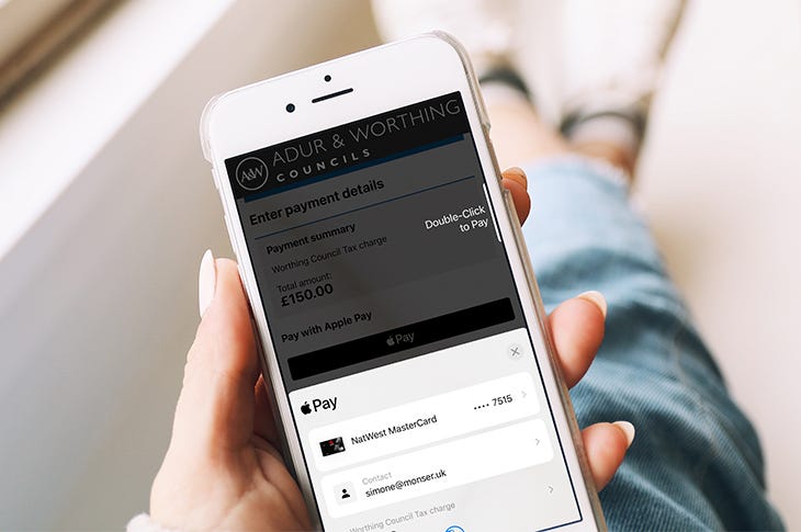 Photo: Paying for a council service using Apple Pay on a mobile phone