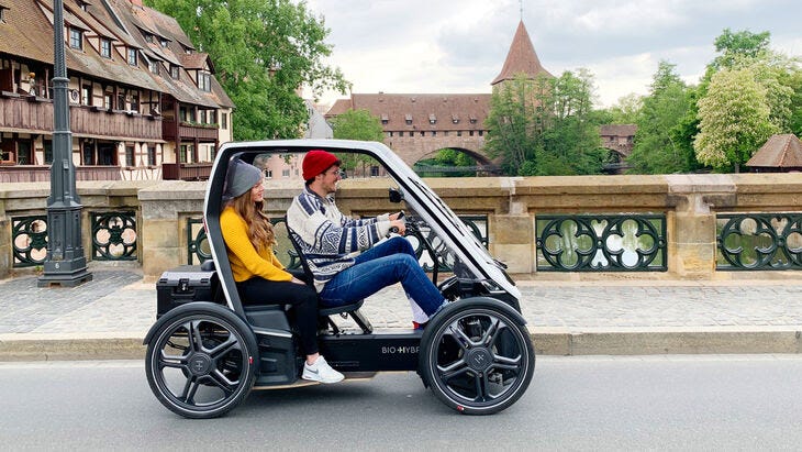 Electric vehicle for 2 person runs the street