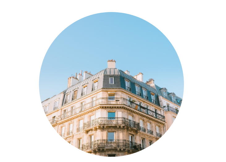 An image of a Paris apartment with blue sky above.