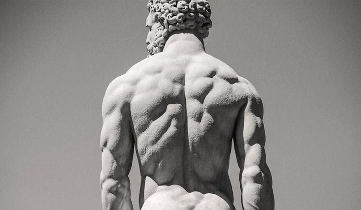 An ancient Greek statue of a muscular man with very good and lean back muscles