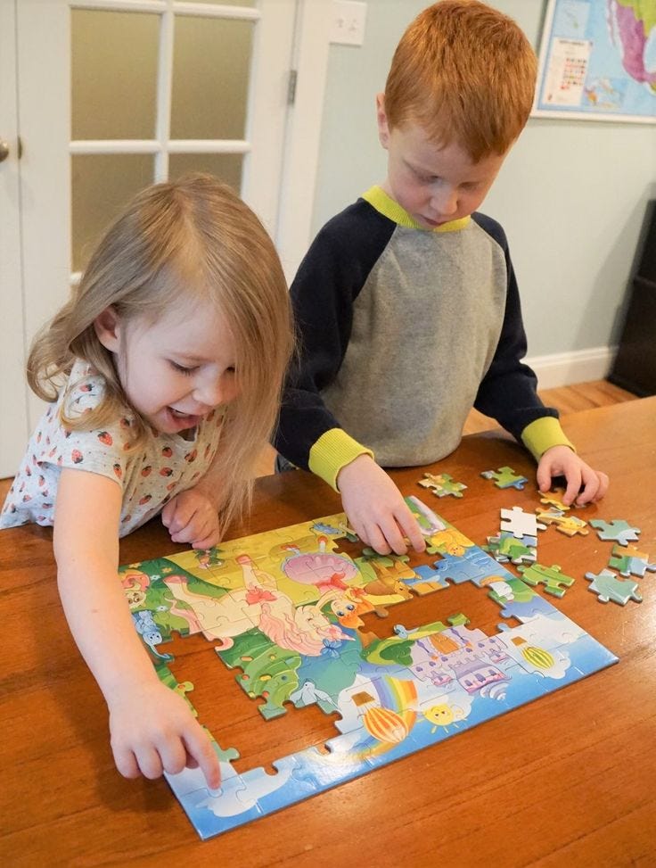 Children enjoying a puzzle party, solving wooden jigsaw puzzles together.