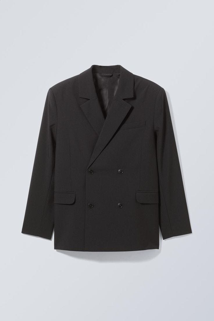 Black blazer with buttoned front, perfect for formal occasions in rainy season