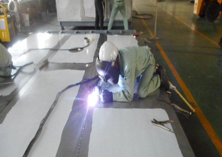 An image showing the welding of lower base plates of stainless steel water storage tanks