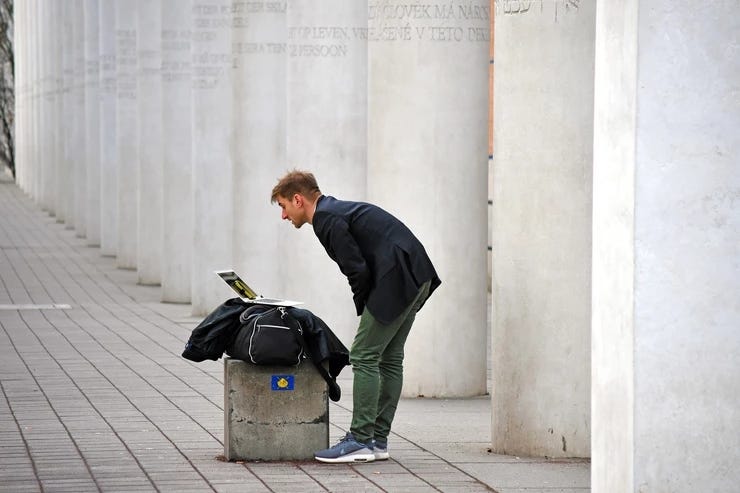 A man infront of the laptop searching for linkedin leads