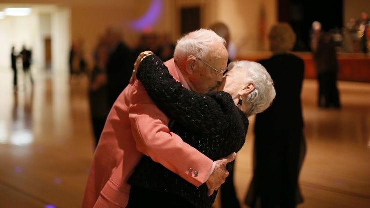 Old couple kissing