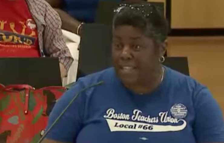 Photo of Curley K-8 School teacher Kafunda Banks speaking to the School Committee