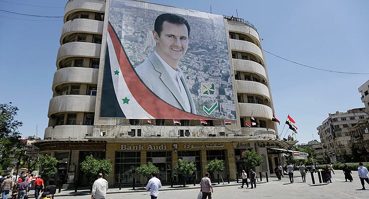 Bashar al-Assad em mural na Síria | AFP 2019 / Joseph EID