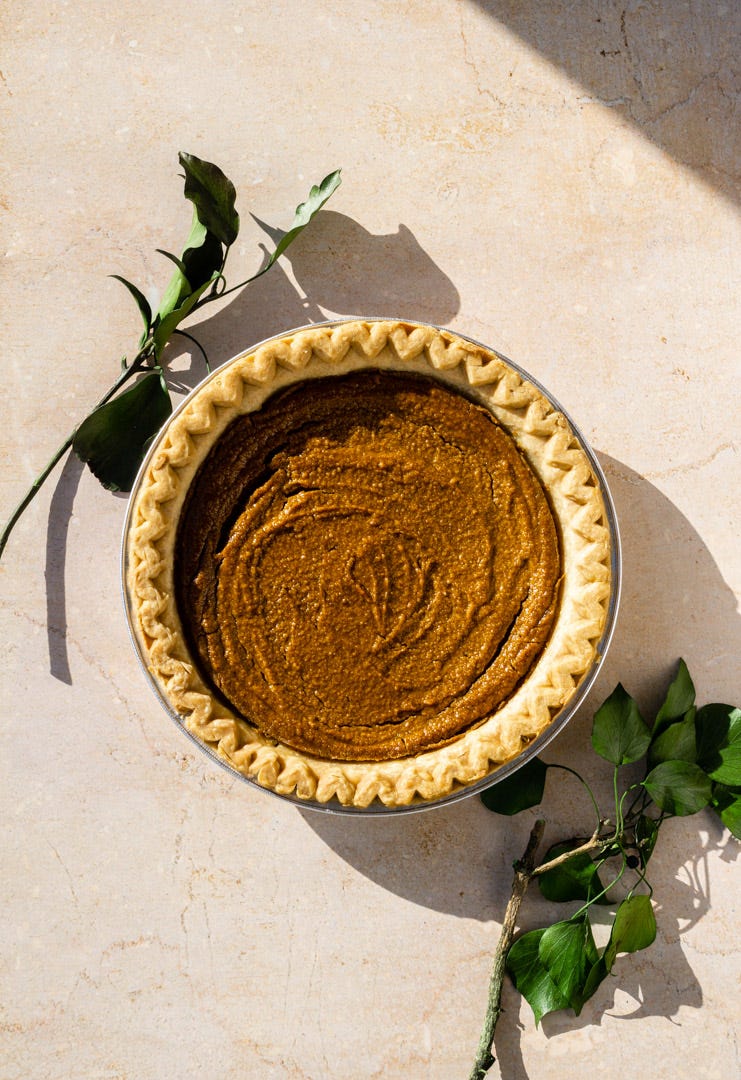 a vegan sweet potato pie with green flowers