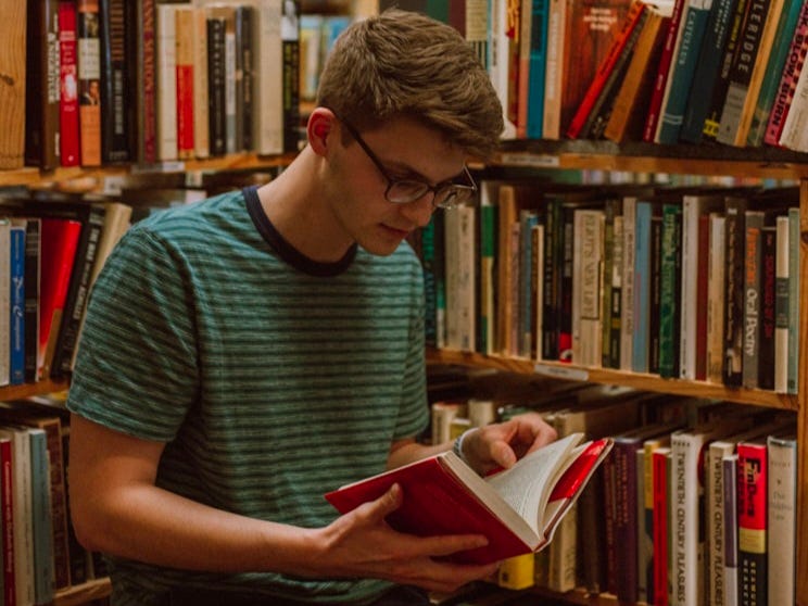 A boy is reading a book